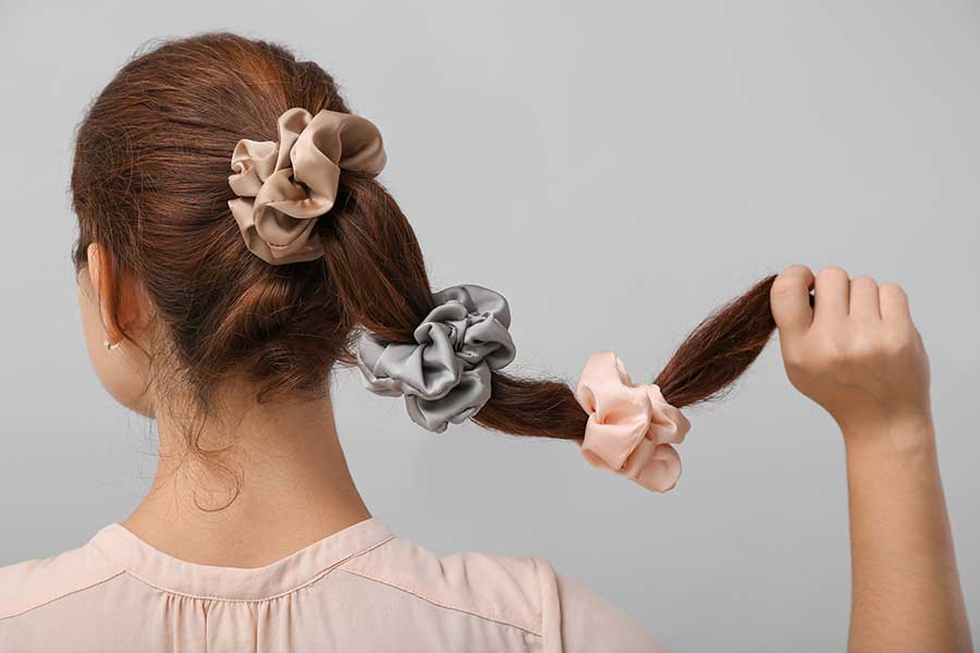 Woman with silk scrunchies